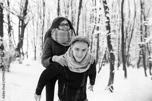 Happy couple playful together in snow park