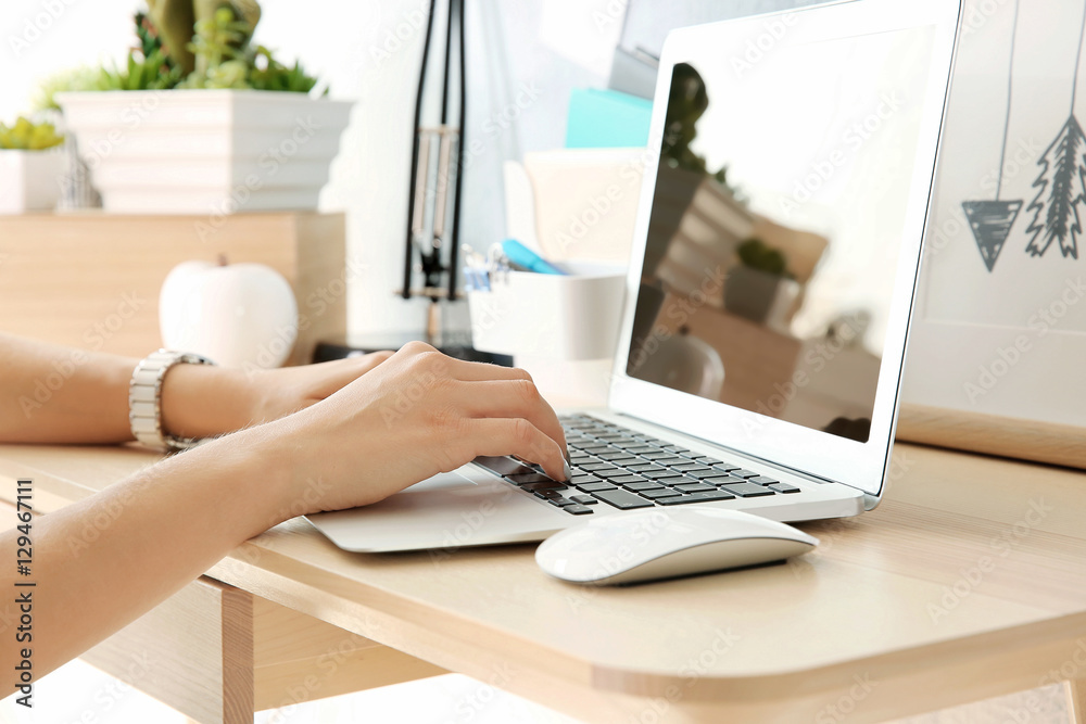 Fototapeta premium Woman working on laptop at home
