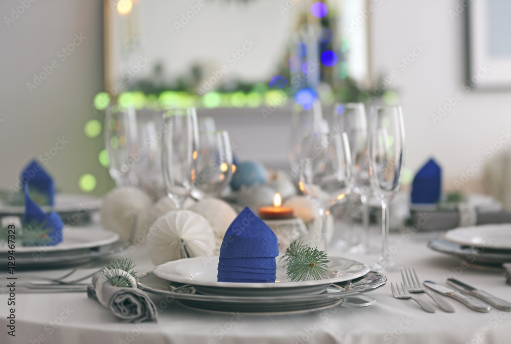 Fototapeta premium Table served for Christmas dinner in living room, close up view