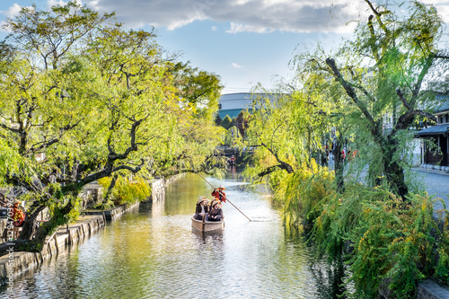 Japanese rowing boats with tourists, lake city japan 