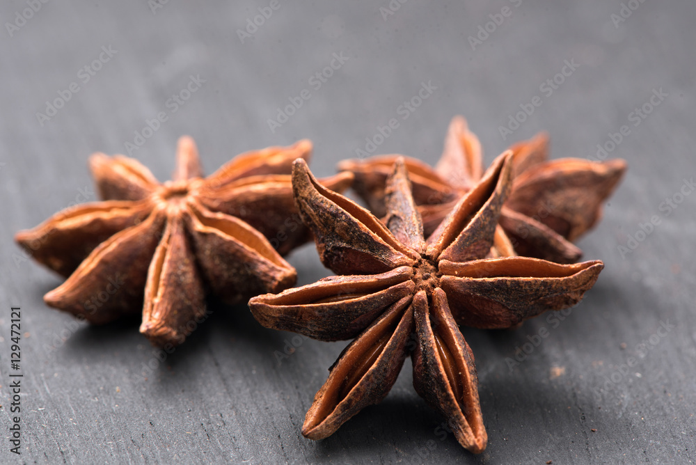 Star anise spice isolated on wooden table Star anise spice isolated on wooden table