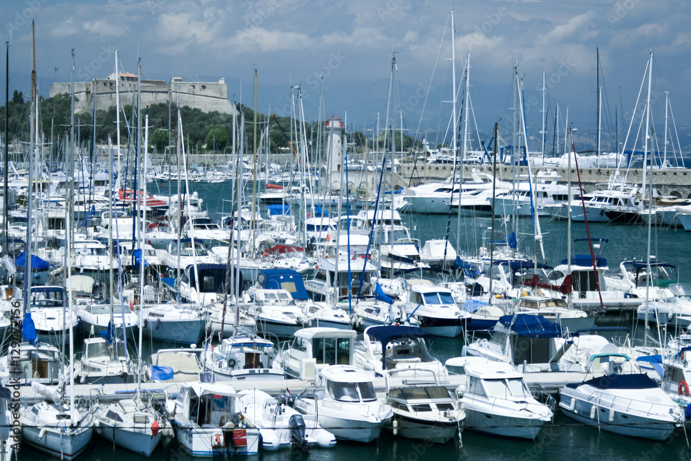 yachts in busy antibes port under fort carre france