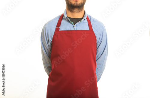 Billede på lærred Young man with red apron