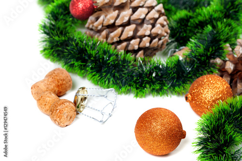 Christmas tinsel, Christmas-tree balls, pine cones and champagne