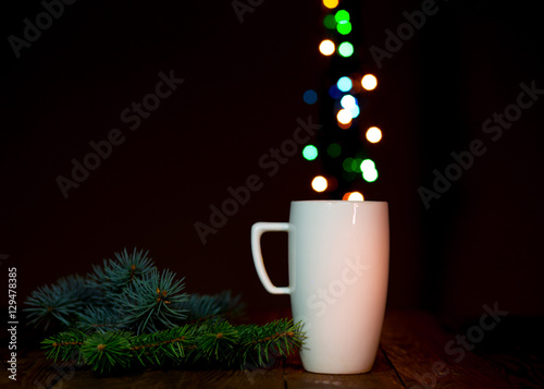 White Coffee Mug and Christmas Lights