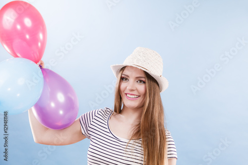 Woman summer joyful girl with colorful balloons © Voyagerix