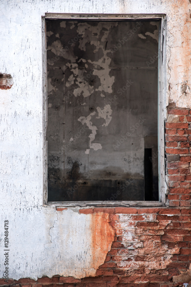 old window on old dirty wall