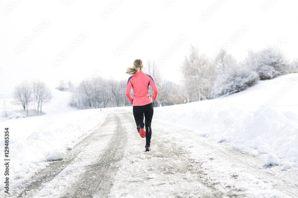 Fitness running woman in winter season