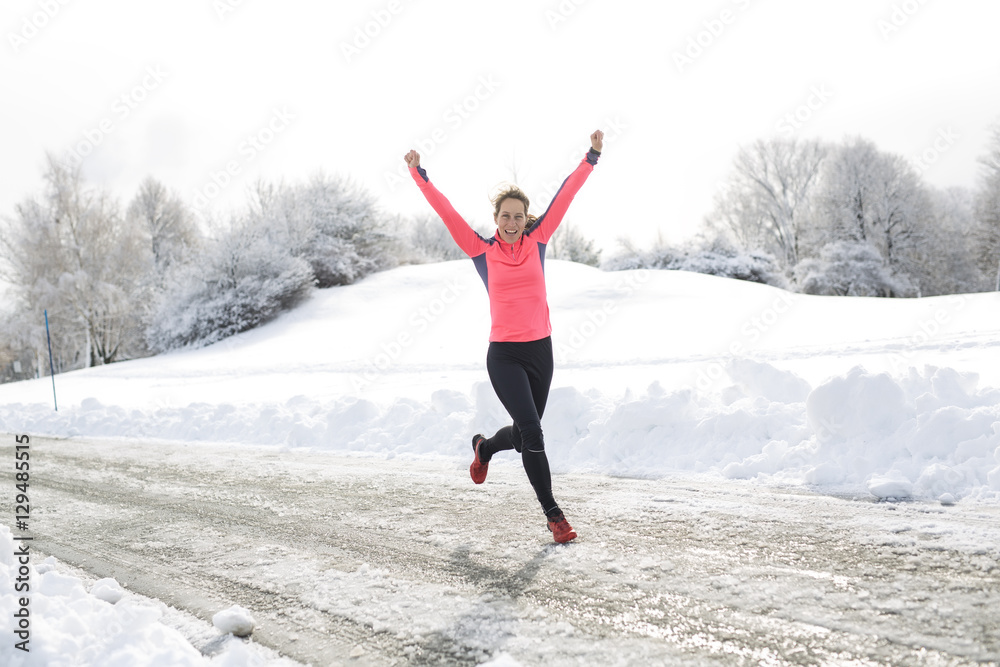 Fitness running woman in winter season Fitness running woman in winter season