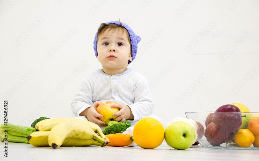 baby surrounded with fruits and vegetables, healthy child nutrition baby surrounded with fruits and vegetables, healthy child nutrition