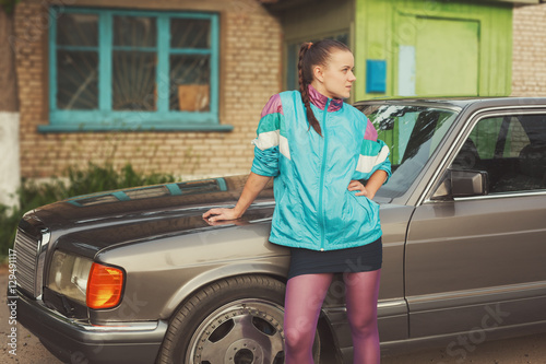 The girl in the nineties is about cars photo