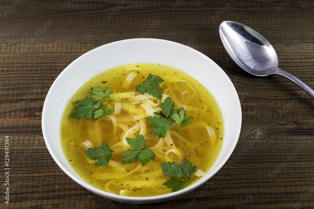 Chicken soup with noodles and parsley leaves. Traditional polish food. Chicken soup with noodles and parsley leaves. Traditional polish food.