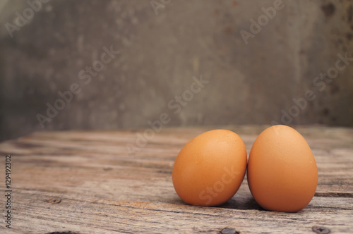 Brown eggs on a old wood table
