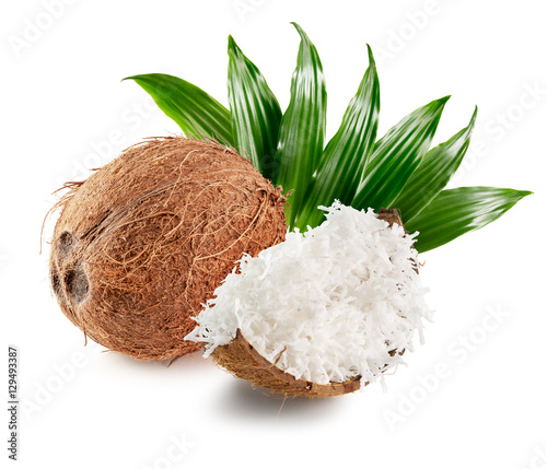 coconut with coconut flakes and leaves isolated on the white bac