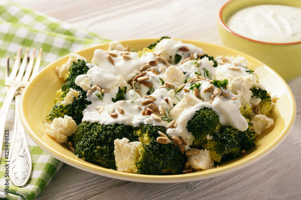 Broccoli salad with feta cheese, garlic dressing and sunflower seeds. Broccoli salad with feta cheese, garlic dressing and sunflower seeds.