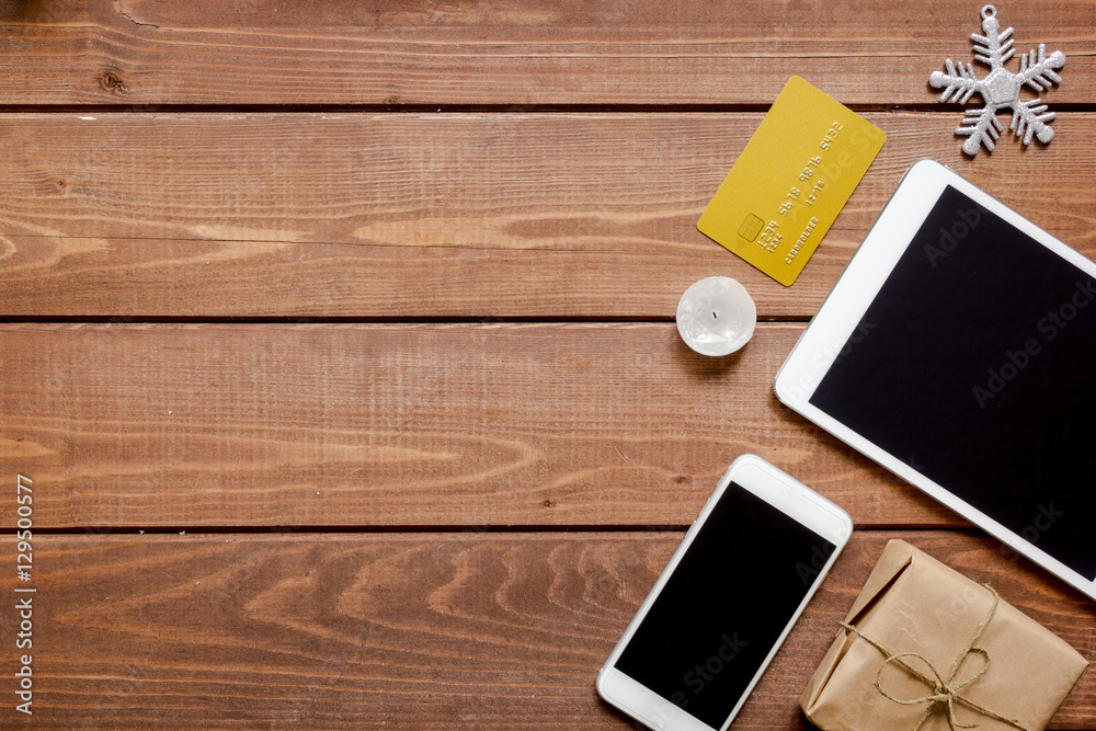 smartphone, tablet, shopping for new year online wooden table smartphone, tablet, shopping for new year online wooden table