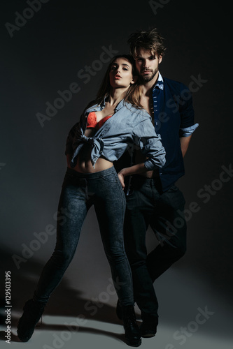 Young couple in unbutton shirts