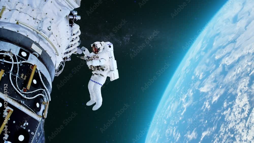 Astronaut in outer space against the planet Earth. 