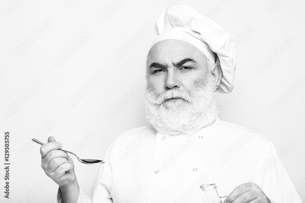 Man cook tastes food Man cook tastes food