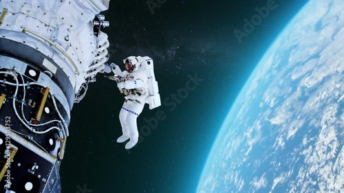 Astronaut in outer space against the planet Earth.  photo