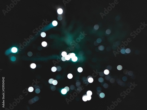 Light blur and defocus bokeh circles on black sky background