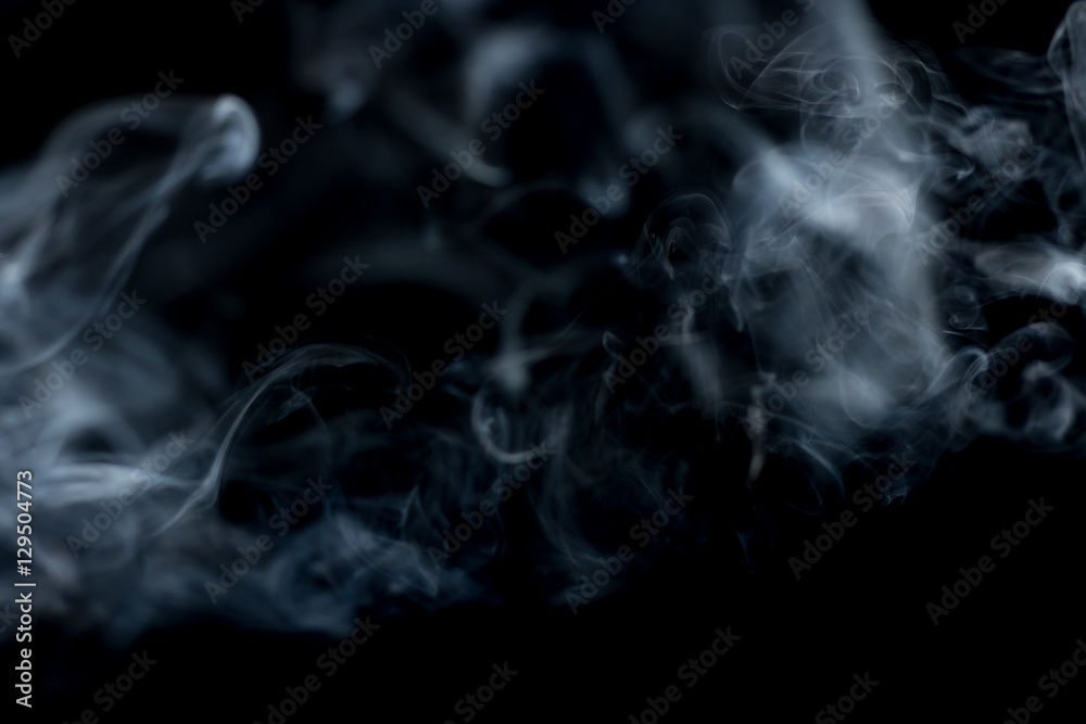 White smoke on a black background.