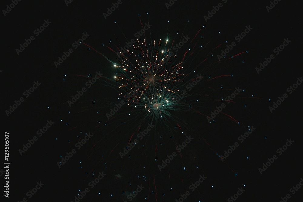Shiny natural fireworks on dark sky background with little smoke Shiny natural fireworks on dark sky background with little smoke