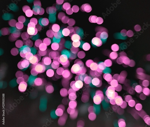 Light blur and defocus bokeh circles on black sky background