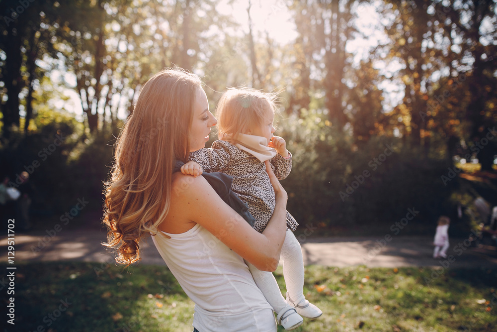 young family walking in the park