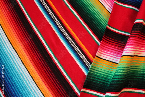 poncho Mexican cinco de mayo blanket serape fiesta traditional Mexico poncho background Mexican stripes copy space blanket  rug minimal simple cinco de mayo serape pattern background  -  stock photo