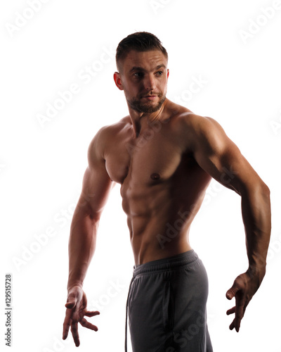 Bodybuilder Posing. Beauty male body.