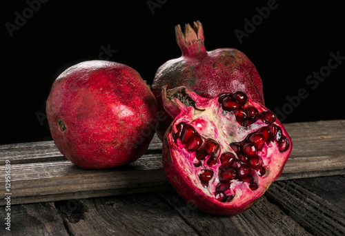 Pomegranate on wooden background