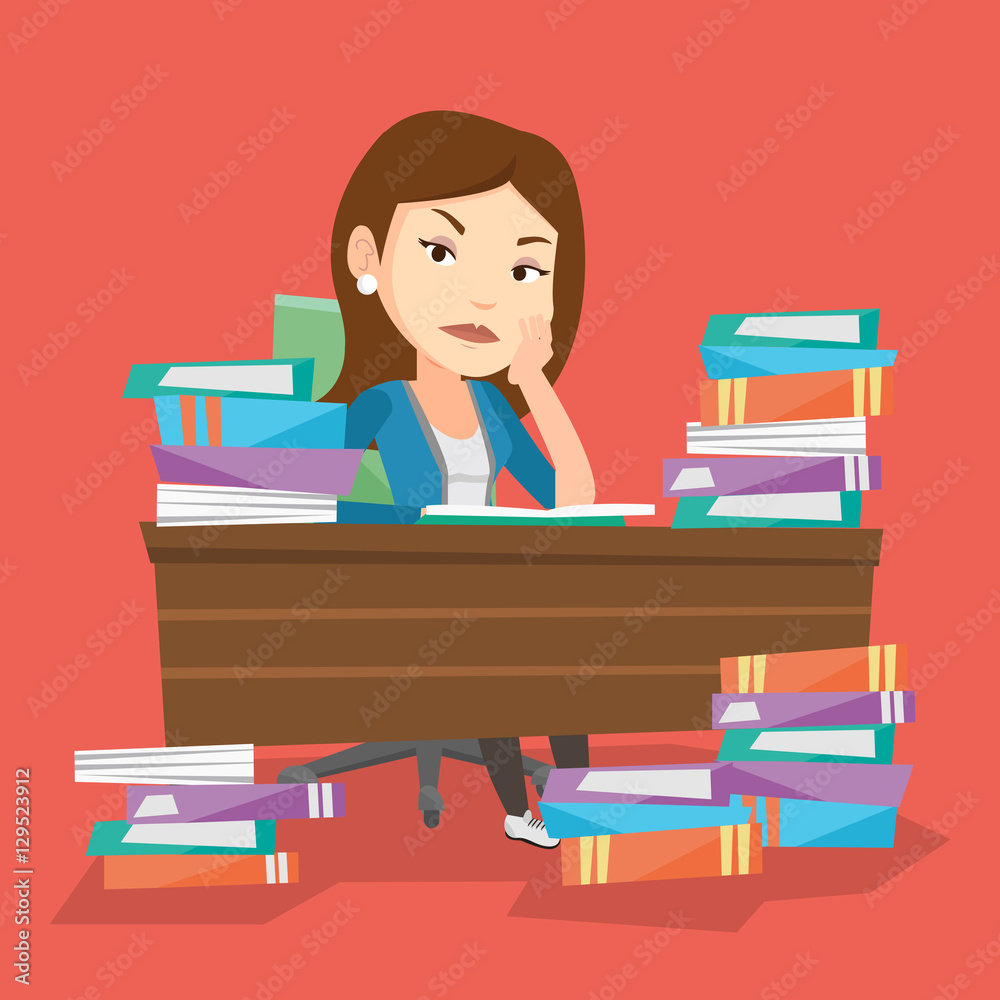 Student sitting at the table with piles of books. Student sitting at the table with piles of books.