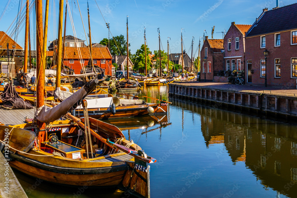Tuinposter met Traditional Dutch Botter Fishing Boats in the Harbor of the historic village of Spakenburg-Bunschoten. The village was once a major fishing center on the now dammed IJselmeer #129525760