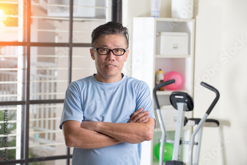 asian senior male at the gym