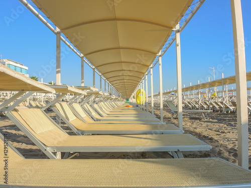 Umbrellas and gazebos on Italian sandy beaches. Adriatic coast. Emilia Romagna region.