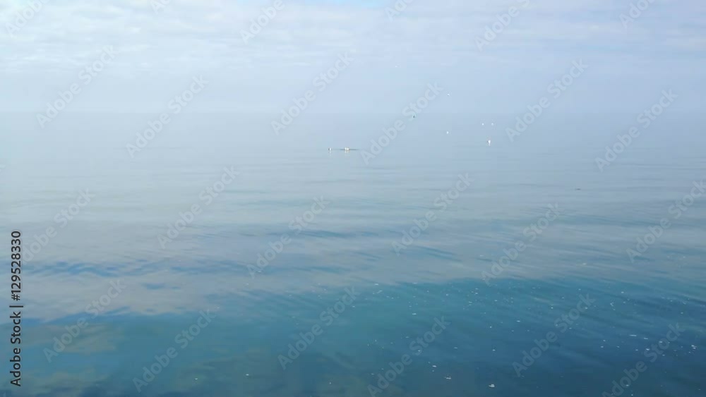 Calm Ocean In The Middle Of The sea. No waves, as calm as can be, like a mirror Calm Ocean In The Middle Of The sea. No waves, as calm as can be, like a mirror