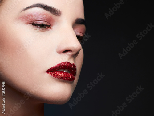 Beauty Model Woman.Beautiful Professional Makeup. Red Lips.Gorgeous Glamour Lady Portrait.Sexy Lips. Beauty Red Lips Makeup Detail.glitter lips