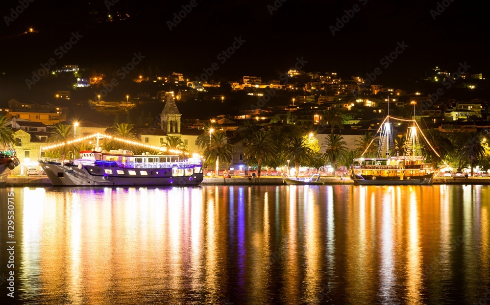 Ships in the port of Makarska at night, popular Croatian resort