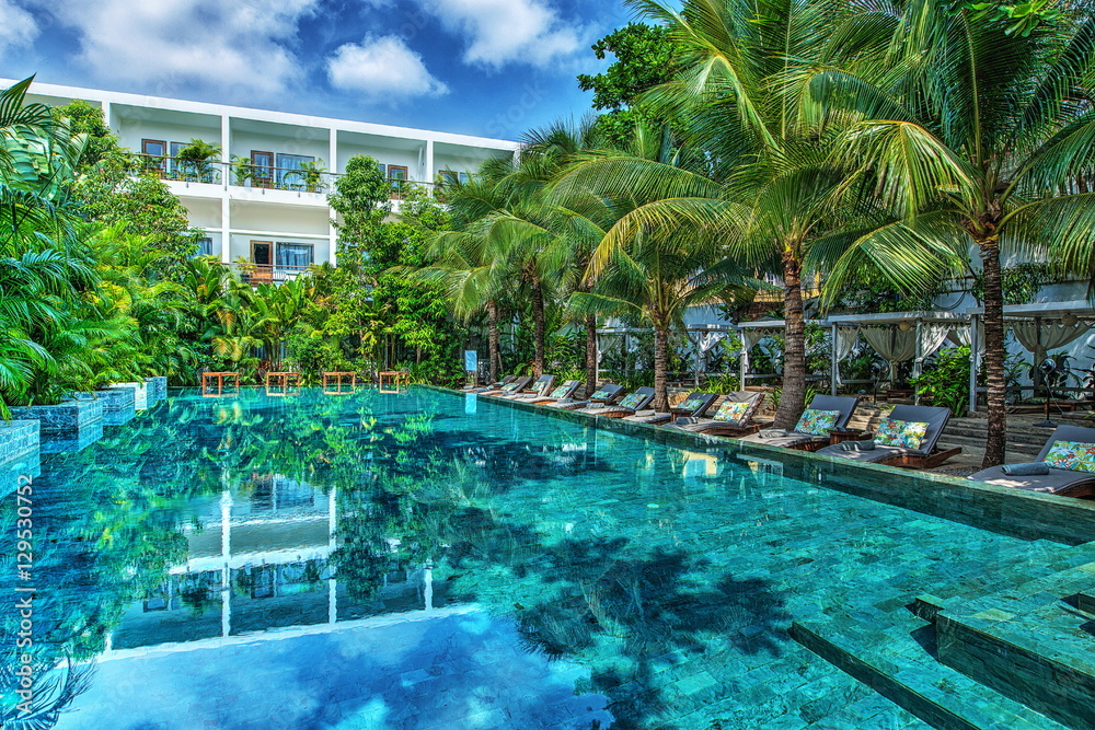 Fototapeta premium Sunbeds near pool