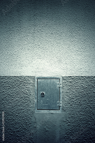 Cement wall with closed door © esebene