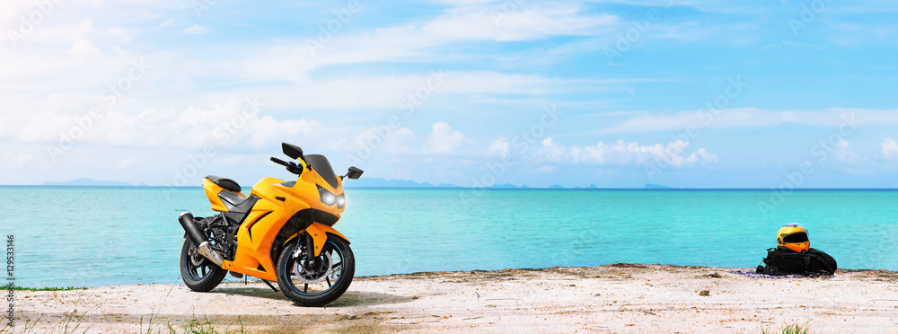 Panoramic scene of sport motorcycle at the beach