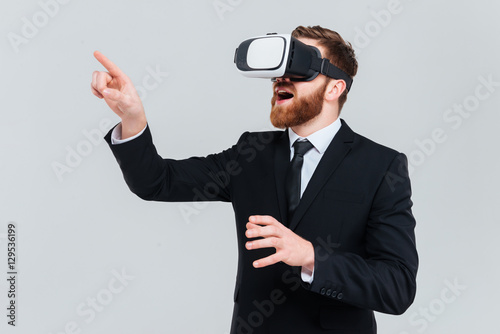 Young business man using virtual reality device