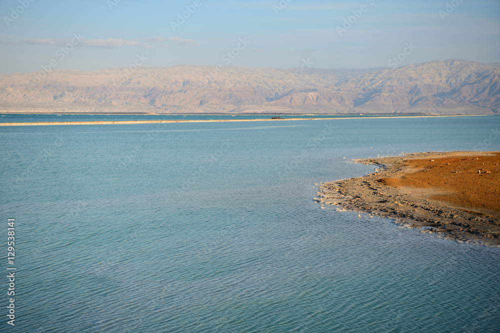 Dead Sea and the coast, lit by the sun in the evening
