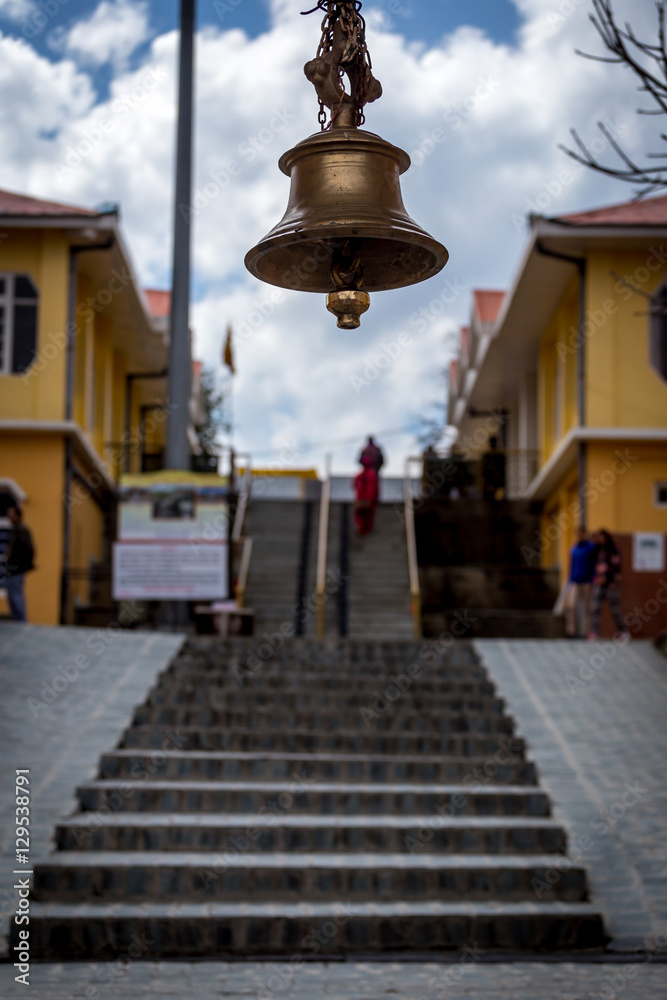 Large beautiful bell hanging on entrance of a temple gate in Shimla, India