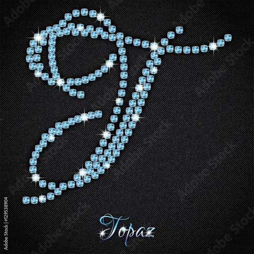 Calligraphic letter T from realistic crystals with sparkles of precious stone Topaz on black denim background. Vector illustration