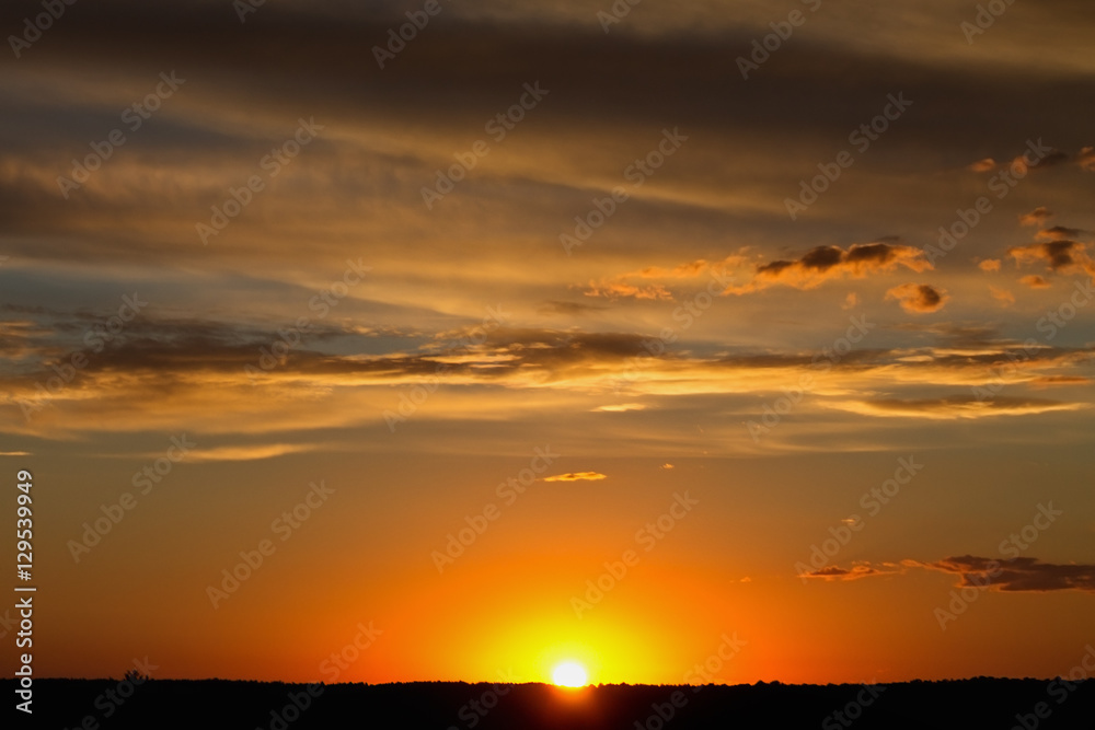 Bright landscape with the setting sun