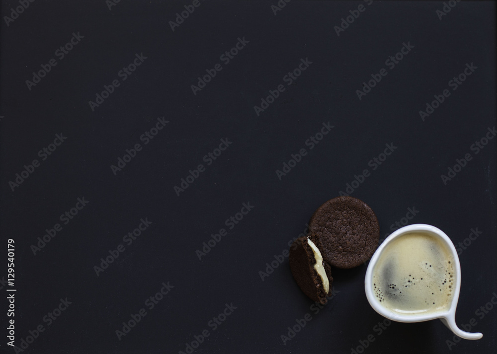 homemade chocolate cookies on a black background with coffee homemade chocolate cookies on a black background with coffee