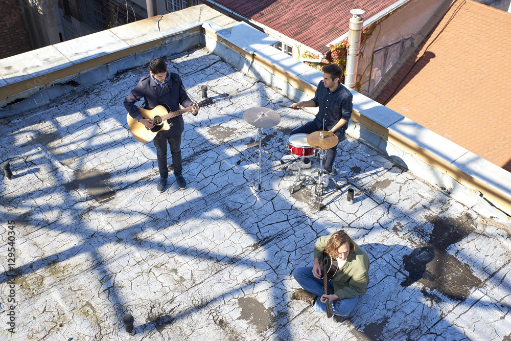 Full length shot of young musicians playing music. Full length shot of young musicians playing music.