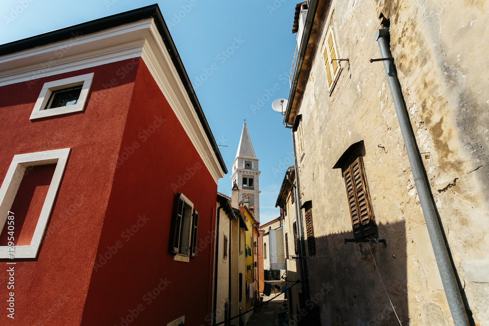 Church of Saint Anthony rises between houses European city Vrsar, Croatia.